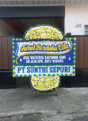 Papan Bunga Duka di Baya Biru