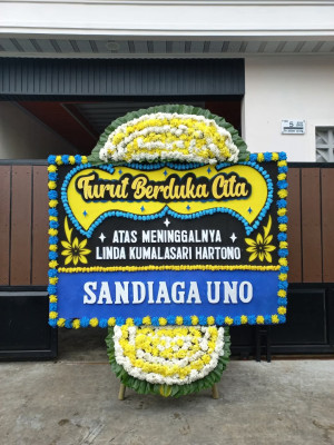 Papan Bunga Duka di Baya Biru